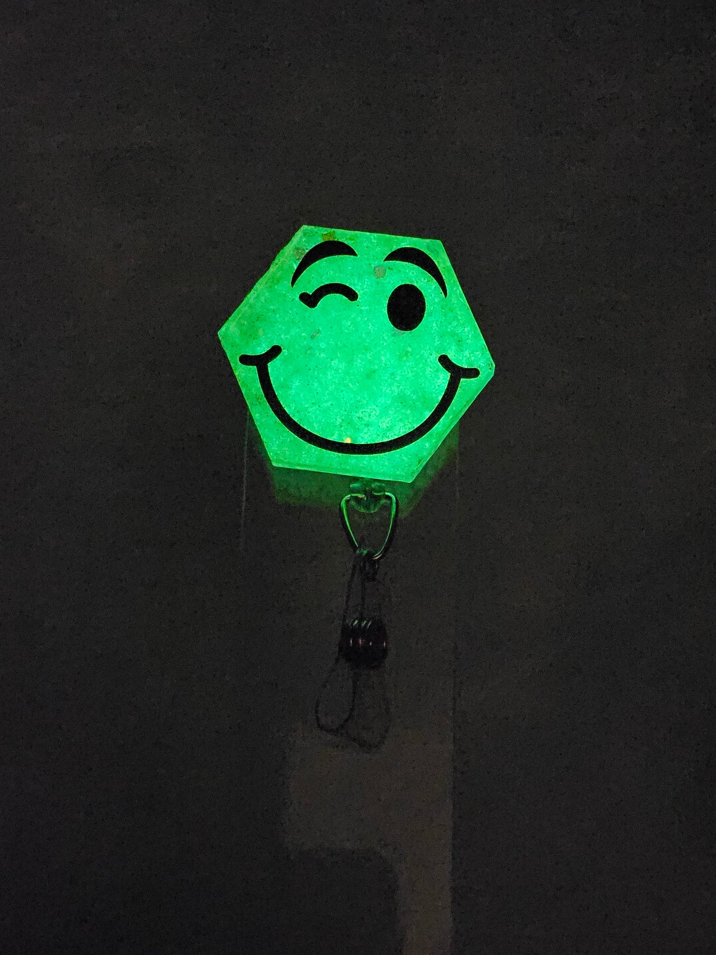 Glow-in-the-Dark "Winking Face" Badge Reel