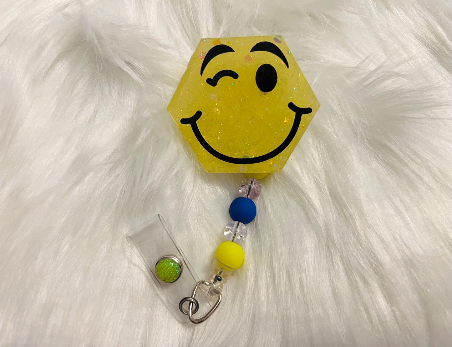 Glow-in-the-Dark "Winking Face" Badge Reel